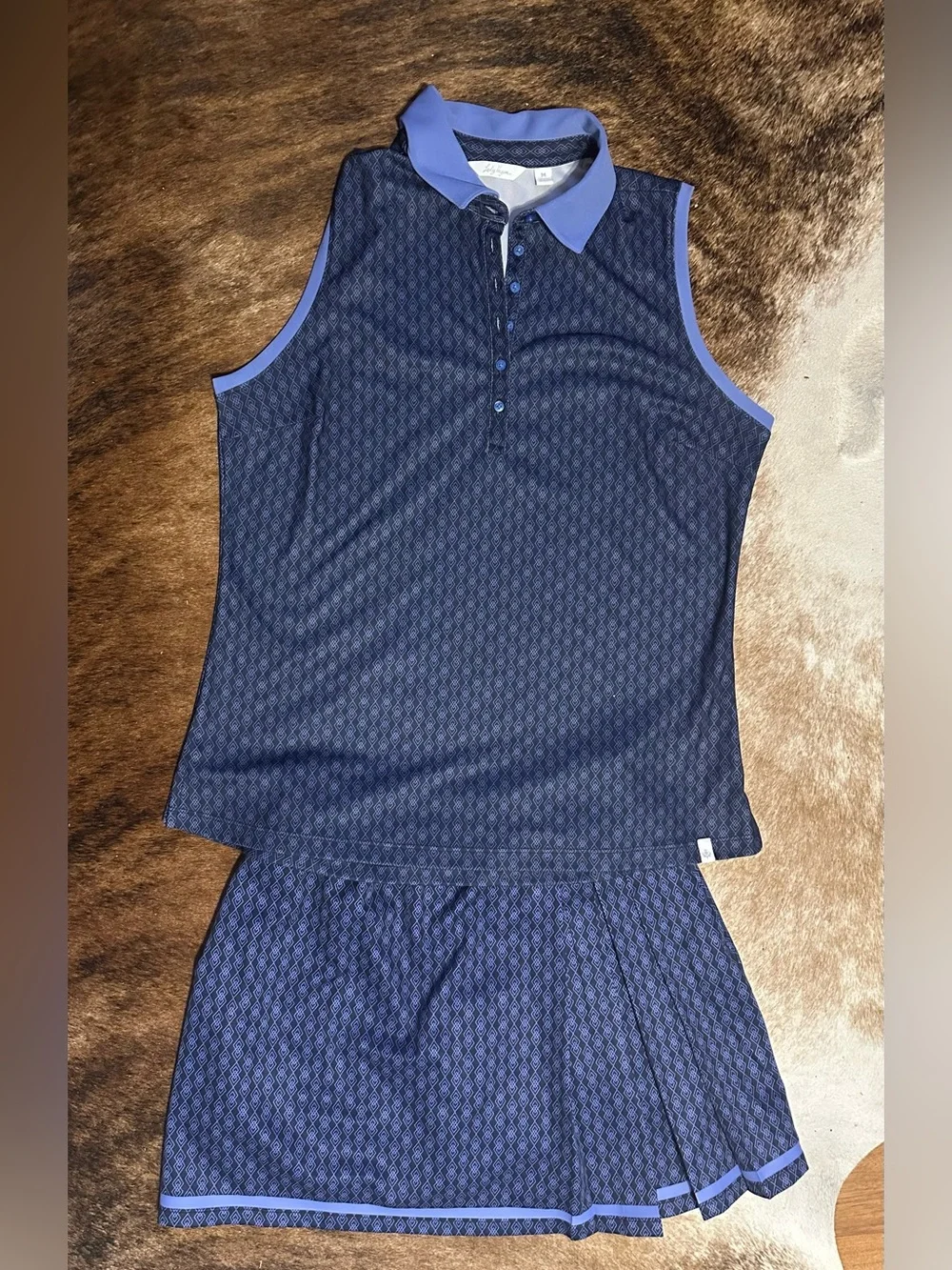 Like new golf set Sleeveless Polo with matching skirt Navy and Light Blue Trim